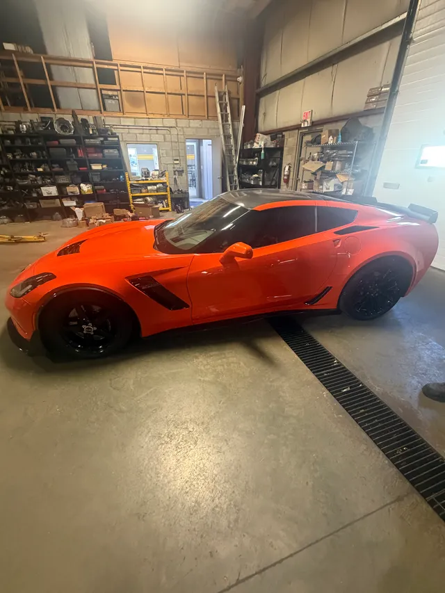 Orange sports car in the workshop