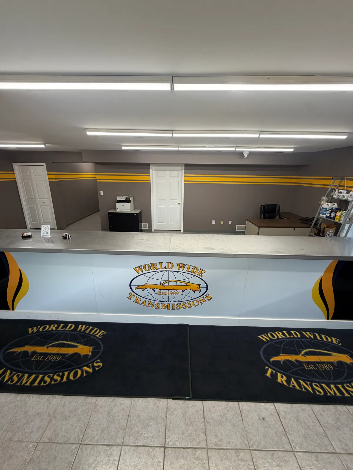 WorldWide Transmissions reception counter with the shop logo
